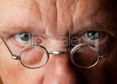 Senior man with focus on glasses