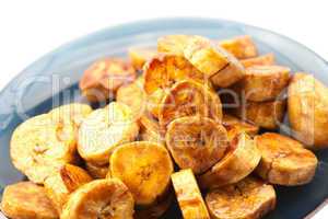 bananas in caramel lying on a plate