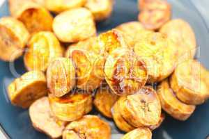 bananas in caramel lying on a plate