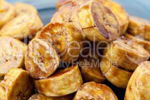 bananas in caramel lying on a plate