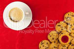 Coffee and cookies on a red background