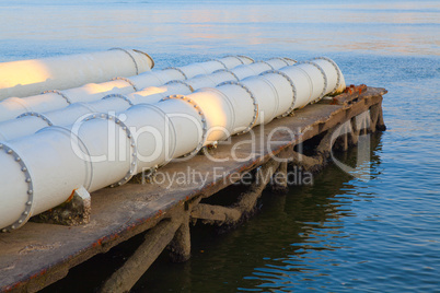 A closeup of large sewage pipes