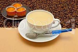 White cup of coffee and coffee beans