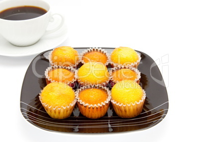 cakes on a plate , isolated over white