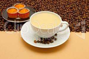 White cup of coffee and coffee beans