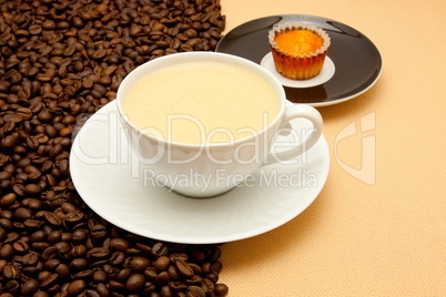 White cup of coffee and coffee beans