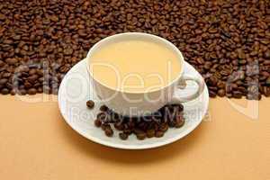 White cup of coffee and coffee beans