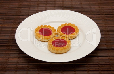 plate of cookies on dark brown background