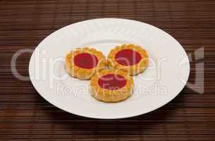 plate of cookies on dark brown background