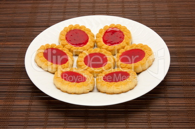 plate of cookies on dark brown background