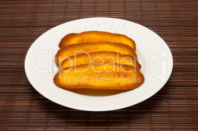 plate of cookies on dark brown background