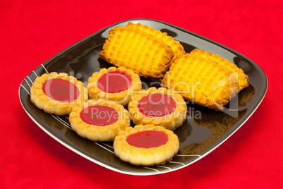 plate of cookies on red background