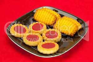 plate of cookies on red background