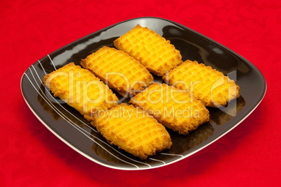 plate of cookies on red background