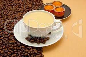 White cup of coffee and coffee beans