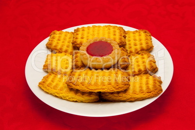 plate of cookies on red background