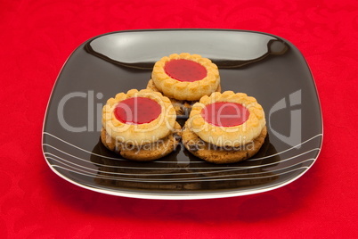 plate of cookies on red background