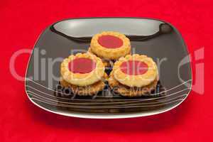 plate of cookies on red background