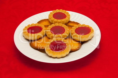 plate of cookies on red background