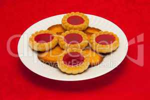 plate of cookies on red background