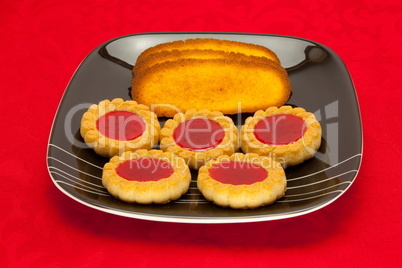 plate of cookies on red background plate of cookies on red background