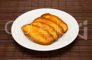 plate of cookies on dark brown background