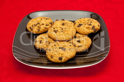 plate of cookies on red background