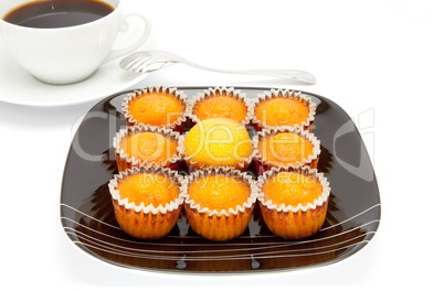 cakes on a plate , isolated over white
