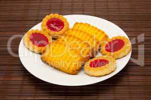 plate of cookies on dark brown background