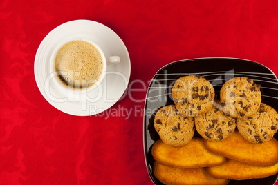 Coffee and cookies on a red background