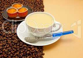 White cup of coffee and coffee beans