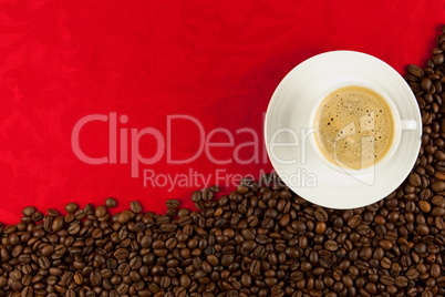 coffee cup from above with coffee beans