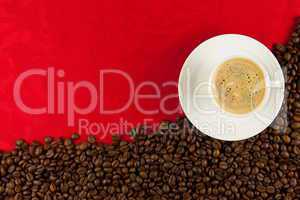 coffee cup from above with coffee beans