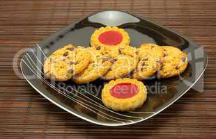 plate of cookies on dark brown background