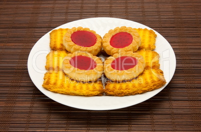 plate of cookies on dark brown background