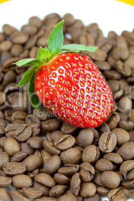 strawberries lying on a background of coffee beans