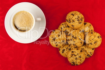 Coffee and cookies on a red background