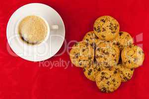 Coffee and cookies on a red background