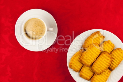 Coffee and cookies on a red background