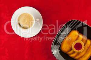 Coffee and cookies on a red background