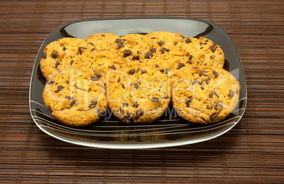 plate of cookies on dark brown background