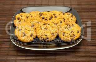 plate of cookies on dark brown background