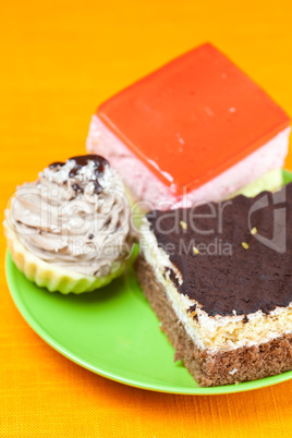 cake at the plate lying on an orange cloth