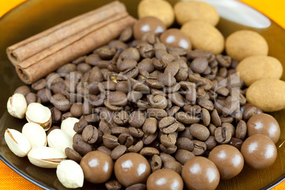 background of coffee beans, cinnamon  and the sweets
