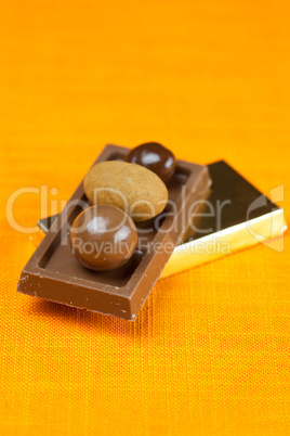 chocolate bars and candy on the orange fabric