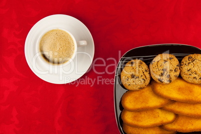 Coffee and cookies on a red background