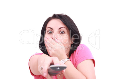 Scared young woman while watching TV in a white background