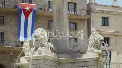 Water fountain, flag and monument in Havana, Cuba
