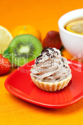 lemon tea ,lemon,mandarin.kiwi,cake and strawberries lying on th