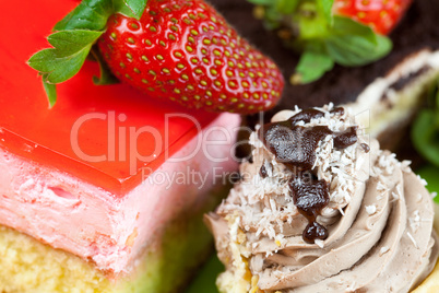 cake and strawberries lying on the orange fabric